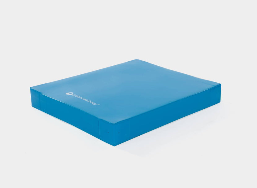 Blue Balance Pad by Balanced Body for stability training.