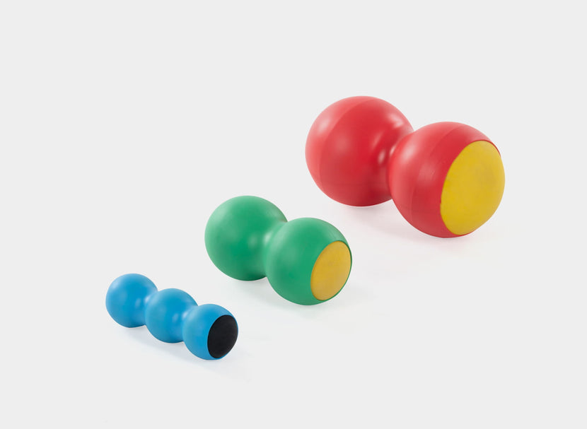 KnotOut in red, green, and blue for muscle tension relief.