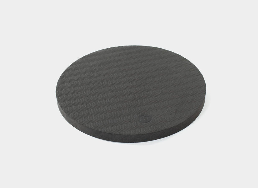 Black rotator disc pad for balance training.