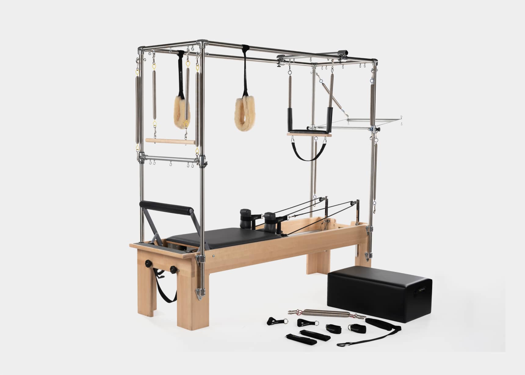 A multi-functional Pilates apparatus designed for versatile workouts, combining a reformer and trapeze.
