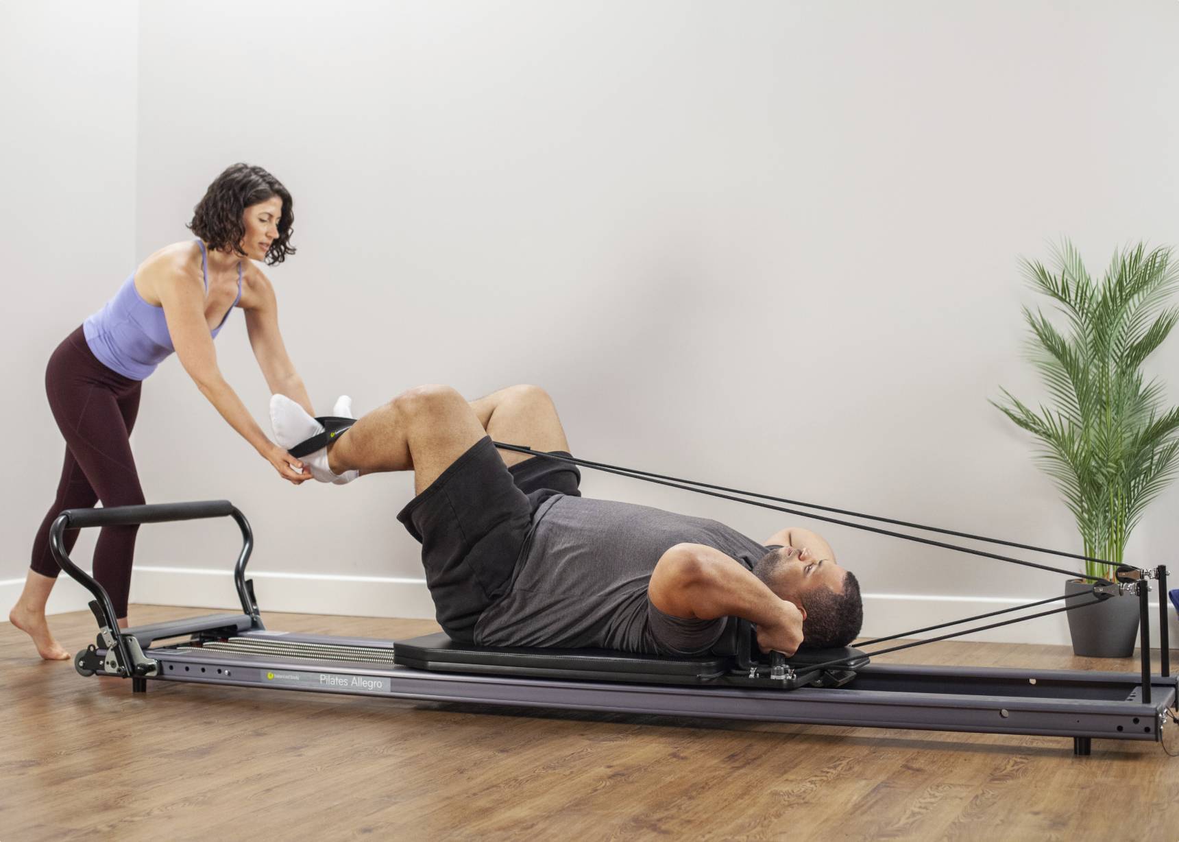 Working out on Allegro® Stretch Reformer product photo