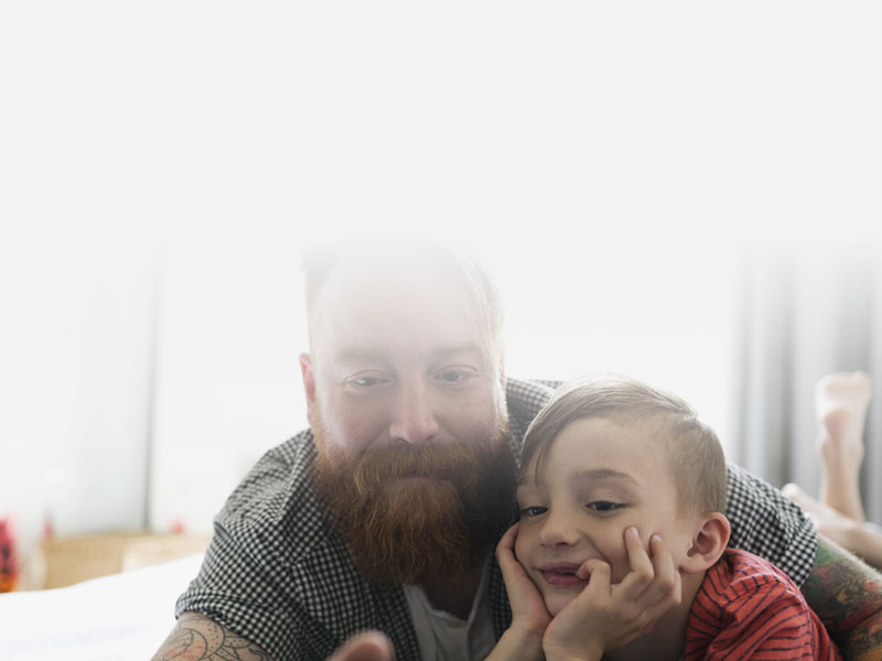 parent with child watching a movie on a tablet