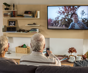 A family enjoying their morning coffee while streaming TV